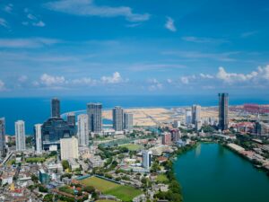 Stunning aerial view of Colombo's urban skyline with a blend of modern architecture and coastal horizon.